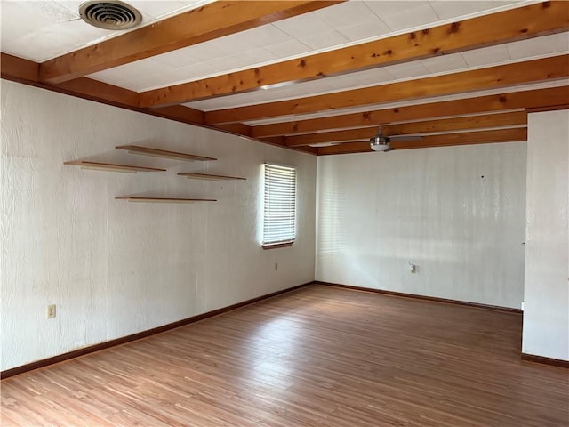490 Lions St, Jefferson, LA 70121 - empty room featuring wood finished floors and beam ceiling