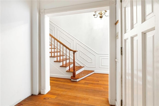 349 Vallette St, New Orleans, LA 70114 - stairway with wood finished floors and a decorative wall