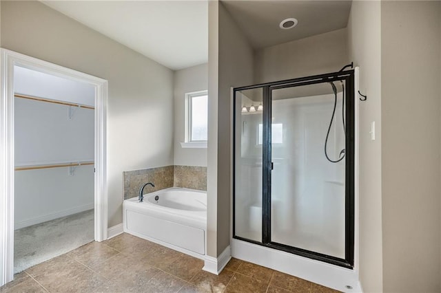 42467 Harlan Pl, Ponchatoula, LA 70454 - full bathroom with a stall shower, a bath, and a walk in closet