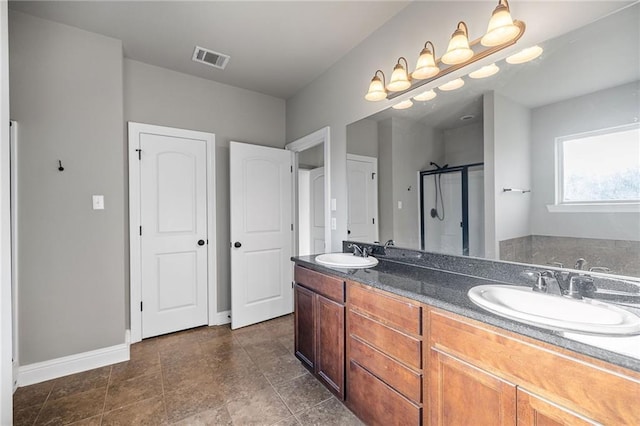 42467 Harlan Pl, Ponchatoula, LA 70454 - bathroom featuring a stall shower, double vanity, and a bath