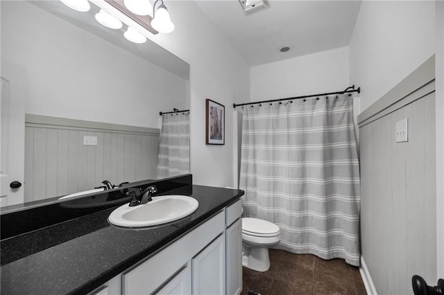 42467 Harlan Pl, Ponchatoula, LA 70454 - full bath featuring vanity, tile patterned flooring, a shower with shower curtain, and a wainscoted wall