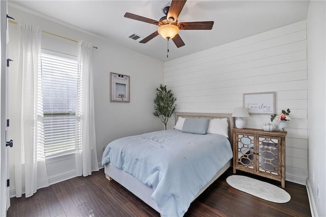 42467 Harlan Pl, Ponchatoula, LA 70454 - bedroom with wood finished floors, ceiling fan, and wooden walls