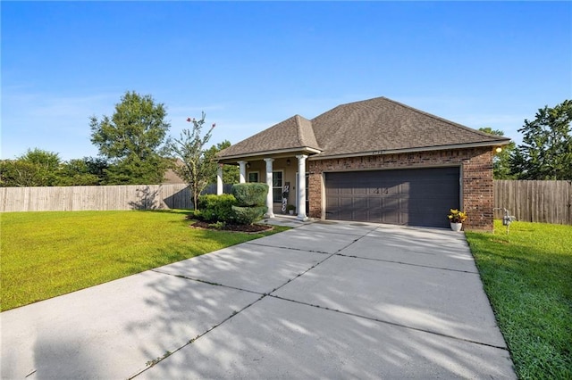 42467 Harlan Pl, Ponchatoula, LA 70454 - single story home with a garage, concrete driveway, brick siding, and a shingled roof