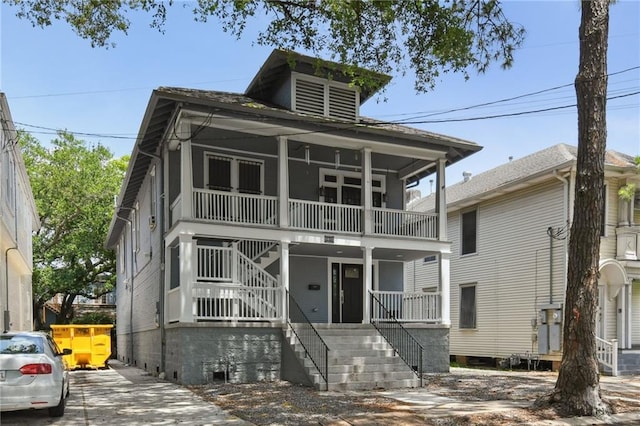 1815 S White St, New Orleans, LA 70125 - view of front facade with stairway, covered porch, and a balcony