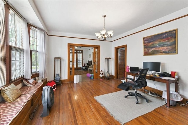 1815 S White St, New Orleans, LA 70125 - home office featuring wood finished floors, a chandelier, and french doors