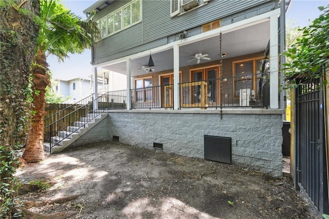 1815 S White St, New Orleans, LA 70125 - back of property featuring ceiling fan, stairs, and crawl space