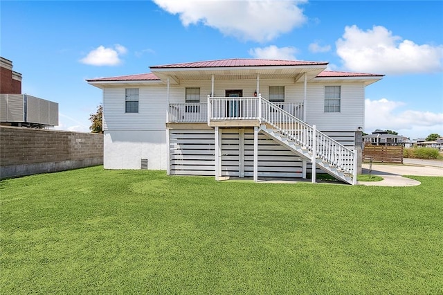 4320 Alba Rd, New Orleans, LA 70129 - rear view of house with stairs and a metal roof