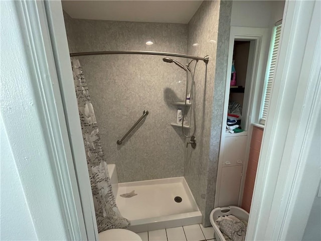 2305 26th St, Kenner, LA 70062 - full bathroom with a shower stall and tile patterned floors