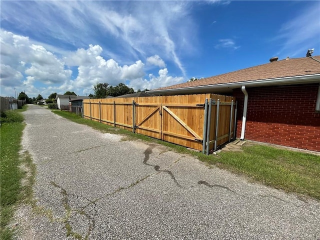 2305 26th St, Kenner, LA 70062 - view of asphalt road with a gate