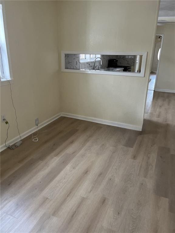 1615 Pratt St, Gretna, LA 70053 - spare room featuring wood finished floors and baseboards