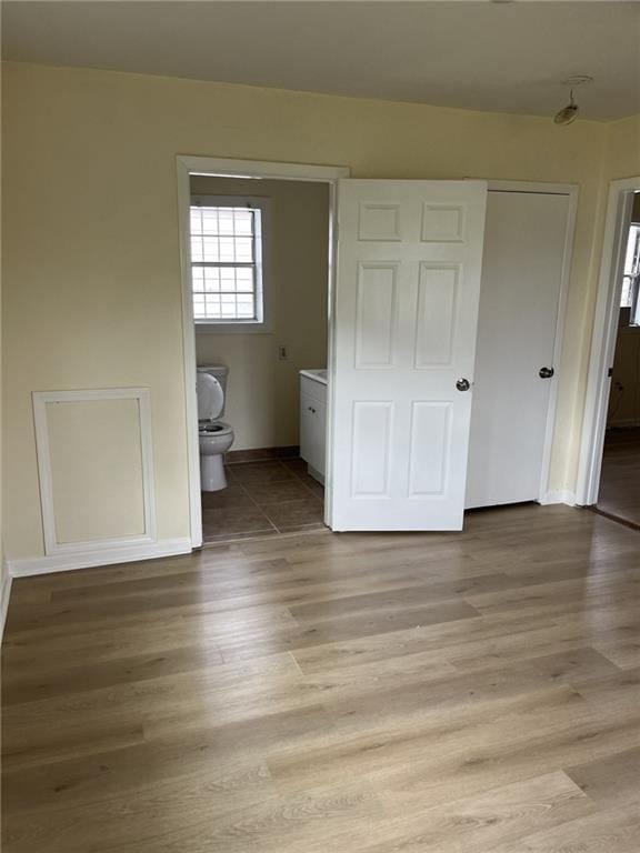 1615 Pratt St, Gretna, LA 70053 - unfurnished bedroom with light wood finished floors and connected bathroom
