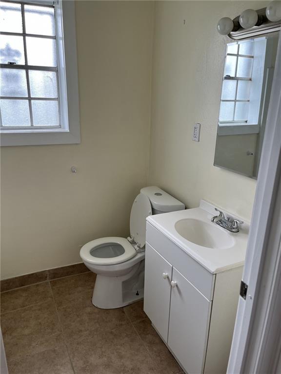 1615 Pratt St, Gretna, LA 70053 - bathroom featuring vanity, healthy amount of natural light, and tile patterned flooring