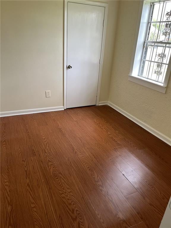 1615 Pratt St, Gretna, LA 70053 - empty room with dark wood-type flooring and baseboards