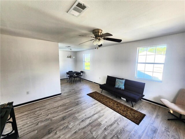 106 Treuil Ln, Belle Chasse, LA 70037 - sitting room with wood finished floors, a ceiling fan, and a textured ceiling