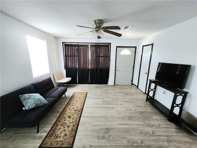 106 Treuil Ln, Belle Chasse, LA 70037 - living area featuring a ceiling fan and light wood-type flooring