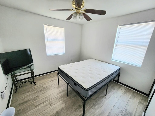 106 Treuil Ln, Belle Chasse, LA 70037 - bedroom with light wood-type flooring and ceiling fan