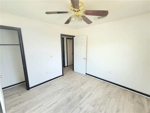 106 Treuil Ln, Belle Chasse, LA 70037 - unfurnished bedroom with light wood-type flooring, a closet, and a ceiling fan