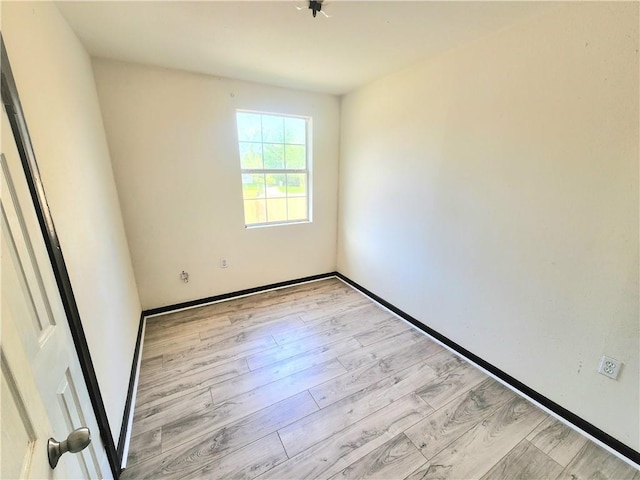 106 Treuil Ln, Belle Chasse, LA 70037 - spare room featuring light wood-style flooring and baseboards