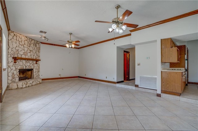 119 Gondrella Dr, Belle Chasse, LA 70037 - unfurnished living room with ceiling fan, ornamental molding, light tile patterned flooring, and a stone fireplace