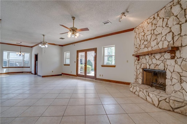 119 Gondrella Dr, Belle Chasse, LA 70037 - unfurnished living room featuring ceiling fan, healthy amount of natural light, a stone fireplace, ornamental molding, and a textured ceiling