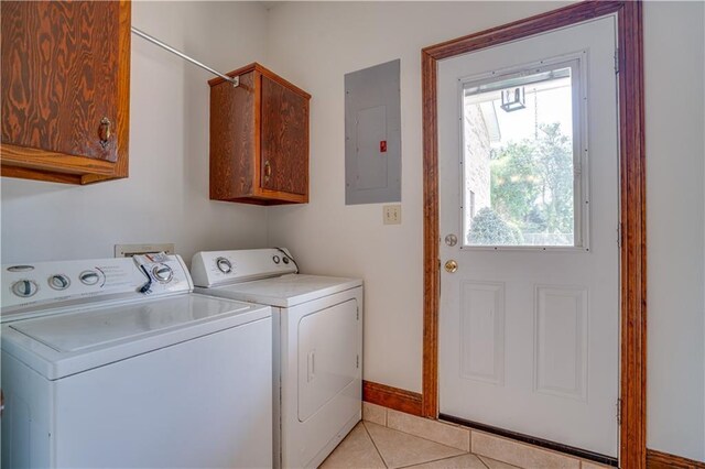 119 Gondrella Dr, Belle Chasse, LA 70037 - washroom featuring electric panel, separate washer and dryer, cabinet space, and light tile patterned floors