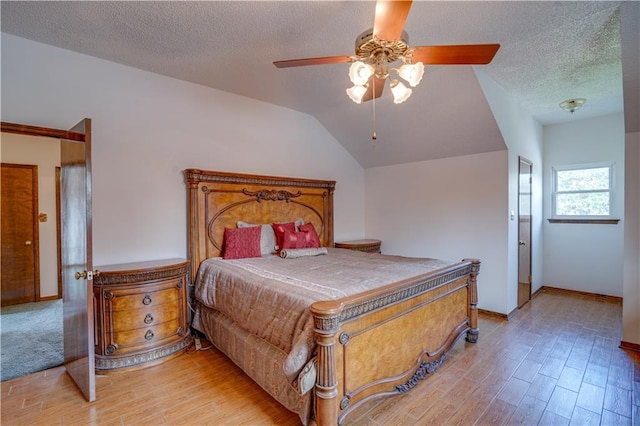 119 Gondrella Dr, Belle Chasse, LA 70037 - bedroom featuring light wood finished floors, a textured ceiling, and ceiling fan