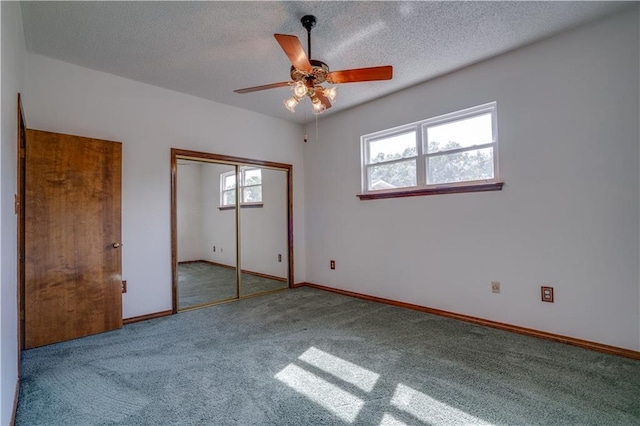 119 Gondrella Dr, Belle Chasse, LA 70037 - unfurnished bedroom with carpet floors, a closet, a textured ceiling, and a ceiling fan