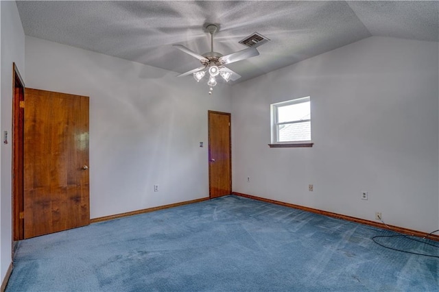 119 Gondrella Dr, Belle Chasse, LA 70037 - empty room featuring a textured ceiling, carpet, lofted ceiling, and a ceiling fan