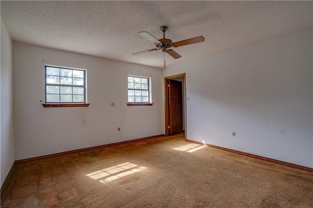 119 Gondrella Dr, Belle Chasse, LA 70037 - spare room featuring carpet floors, ceiling fan, and a textured ceiling