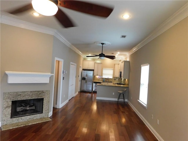 22 Davis Blvd, Jefferson, LA 70121 - unfurnished living room with a ceiling fan, dark wood-style floors, crown molding, recessed lighting, and a premium fireplace