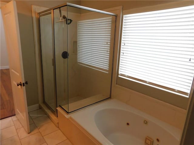22 Davis Blvd, Jefferson, LA 70121 - bathroom featuring a shower stall, a jetted tub, and tile patterned flooring