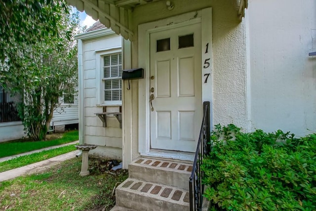 157 Gruner Rd, Metairie, LA 70001 - doorway to property featuring stucco siding