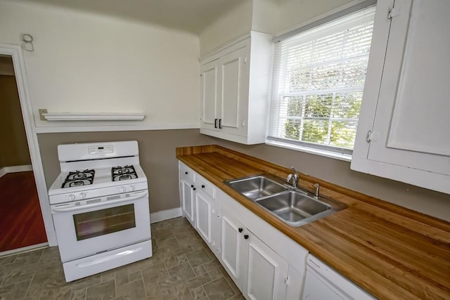 157 Gruner Rd, Metairie, LA 70001 - kitchen with white appliances, white cabinetry, and wooden counters