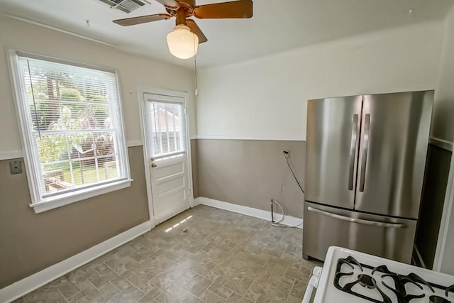 157 Gruner Rd, Metairie, LA 70001 - kitchen with freestanding refrigerator, ceiling fan, stone finish floors, and stove