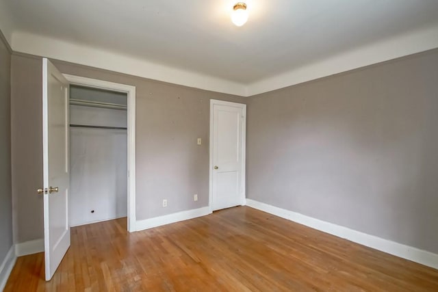157 Gruner Rd, Metairie, LA 70001 - unfurnished bedroom featuring wood finished floors and a closet