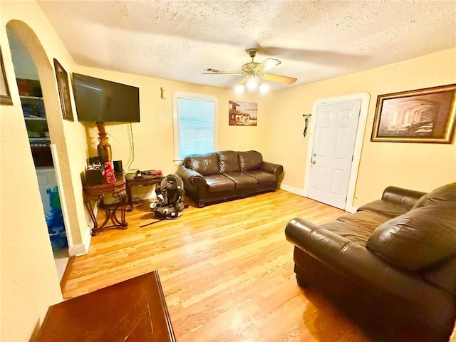 632 Eiseman St, Marrero, LA 70072 - living room with a textured ceiling, wood finished floors, and a ceiling fan