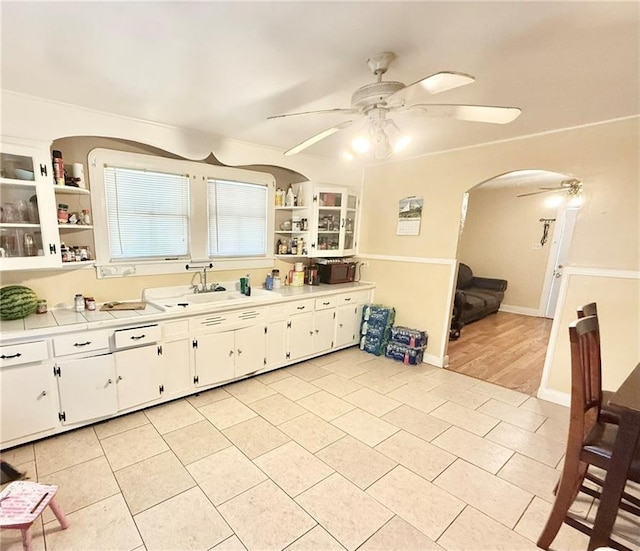 632 Eiseman St, Marrero, LA 70072 - kitchen featuring ceiling fan, open shelves, arched walkways, and light tile patterned floors