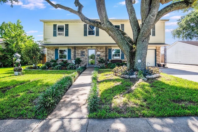 1500 Madewood Rd, La Place, LA 70068 - view of front of house with a garage, driveway, a front yard, and brick siding