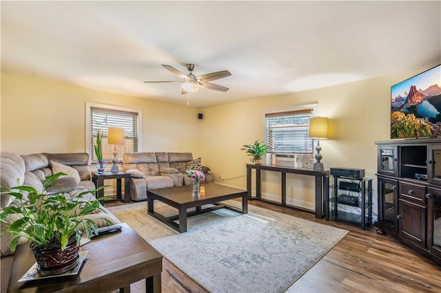 1500 Madewood Rd, La Place, LA 70068 - living room featuring healthy amount of natural light, a ceiling fan, and wood finished floors
