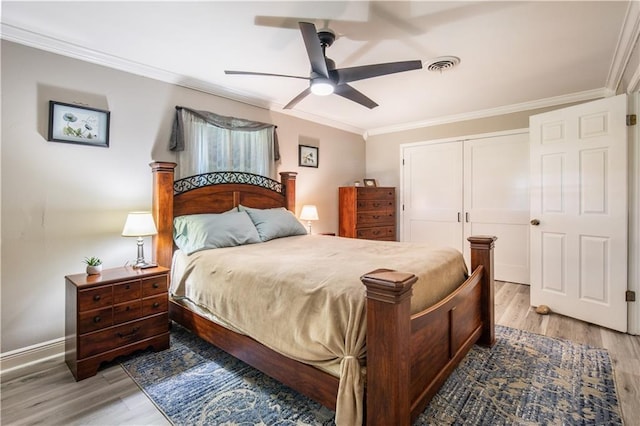 1500 Madewood Rd, La Place, LA 70068 - bedroom featuring crown molding, wood finished floors, a closet, and ceiling fan