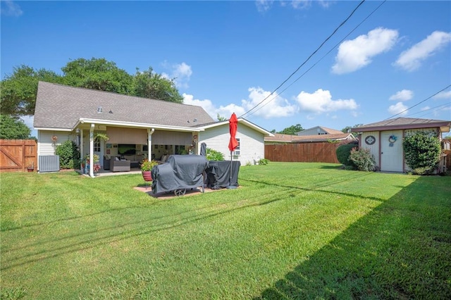 1500 Madewood Rd, La Place, LA 70068 - rear view of property featuring an outdoor living space, a storage shed, and a patio