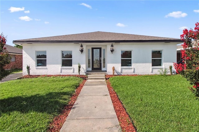 57 Driftwood Blvd, Kenner, LA 70065 - bungalow-style home featuring brick siding, a front yard, and a shingled roof