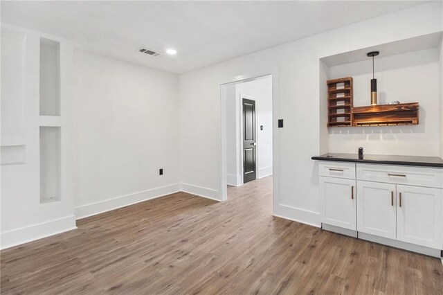 57 Driftwood Blvd, Kenner, LA 70065 - bar with wood finished floors, recessed lighting, and decorative light fixtures