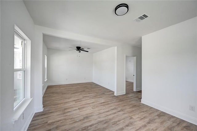 9126 Dixon St, New Orleans, LA 70118 - empty room with wood finished floors and a ceiling fan