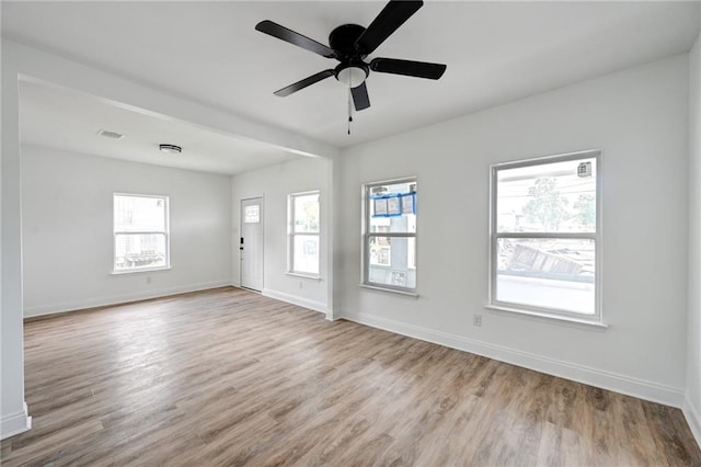 9126 Dixon St, New Orleans, LA 70118 - empty room with wood finished floors and ceiling fan