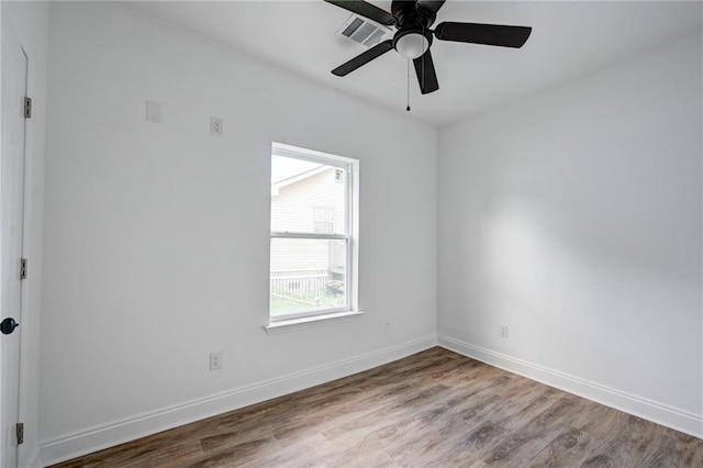 9126 Dixon St, New Orleans, LA 70118 - empty room featuring wood finished floors and ceiling fan