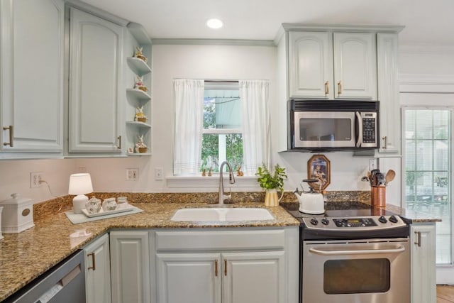 4320 Academy Dr, Metairie, LA 70003 - kitchen with appliances with stainless steel finishes, plenty of natural light, crown molding, light stone counters, and open shelves