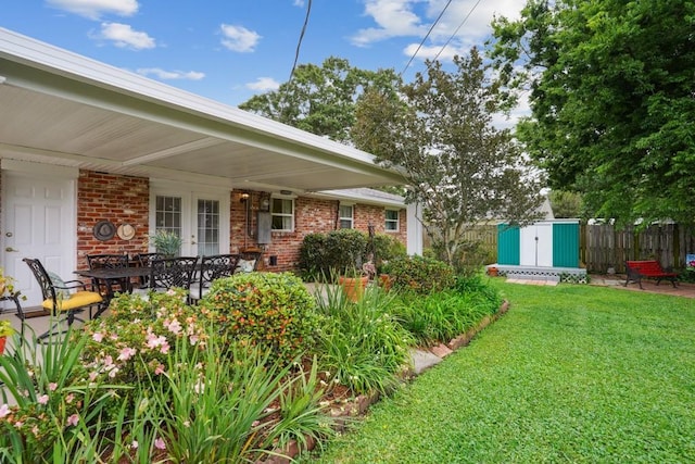 4320 Academy Dr, Metairie, LA 70003 - view of yard featuring a shed, french doors, and a patio