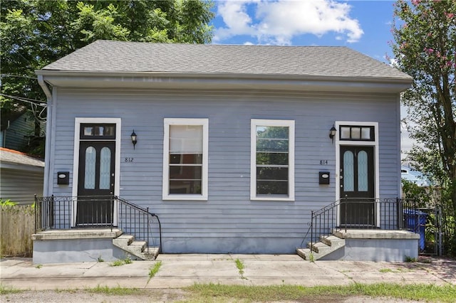 81214 Eliza St, New Orleans, LA 70114 - shotgun-style home featuring roof with shingles