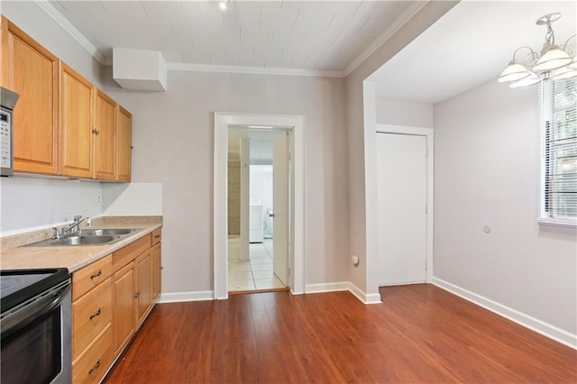 81214 Eliza St, New Orleans, LA 70114 - kitchen featuring electric stove, crown molding, light countertops, dark wood-type flooring, and a chandelier
